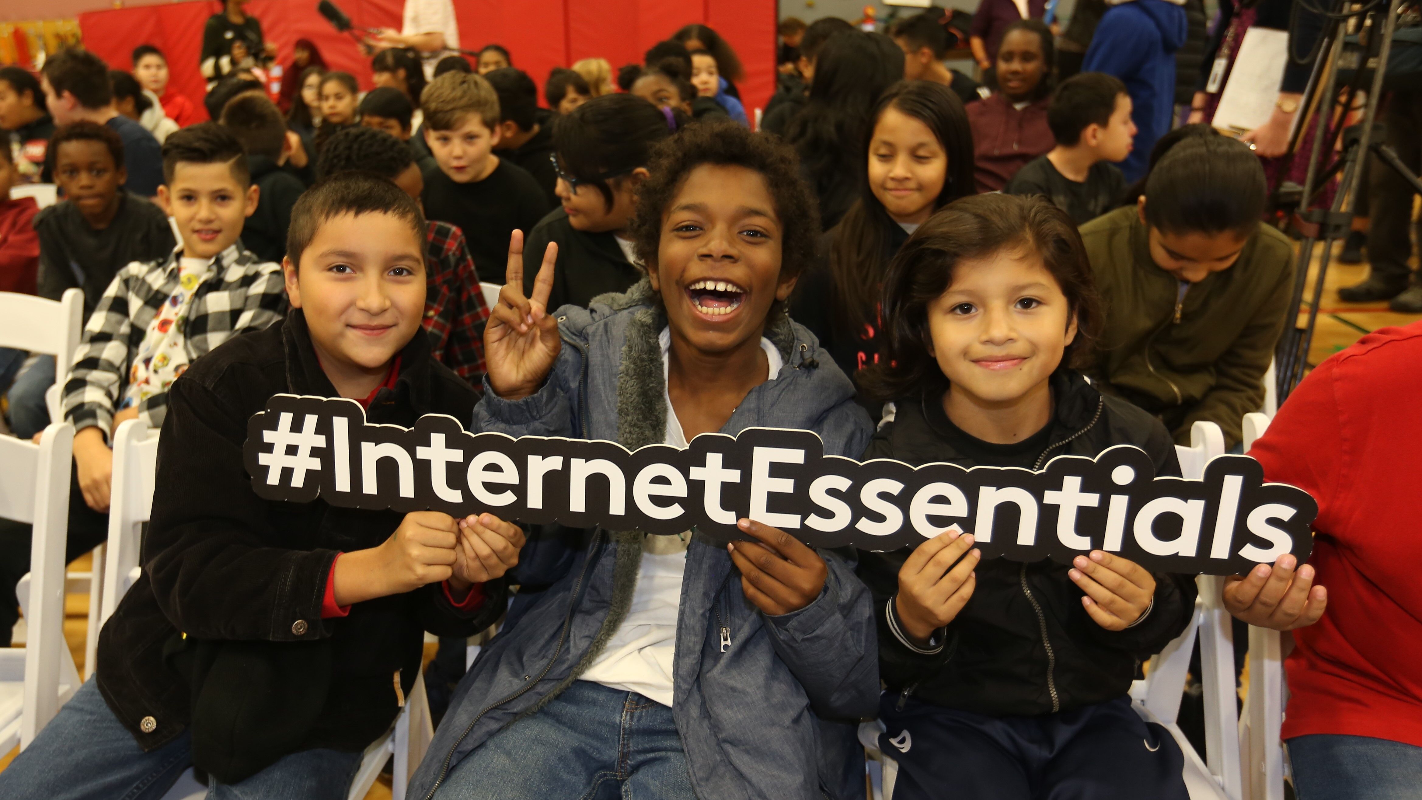 Students cheer at an Internet Essentials event.