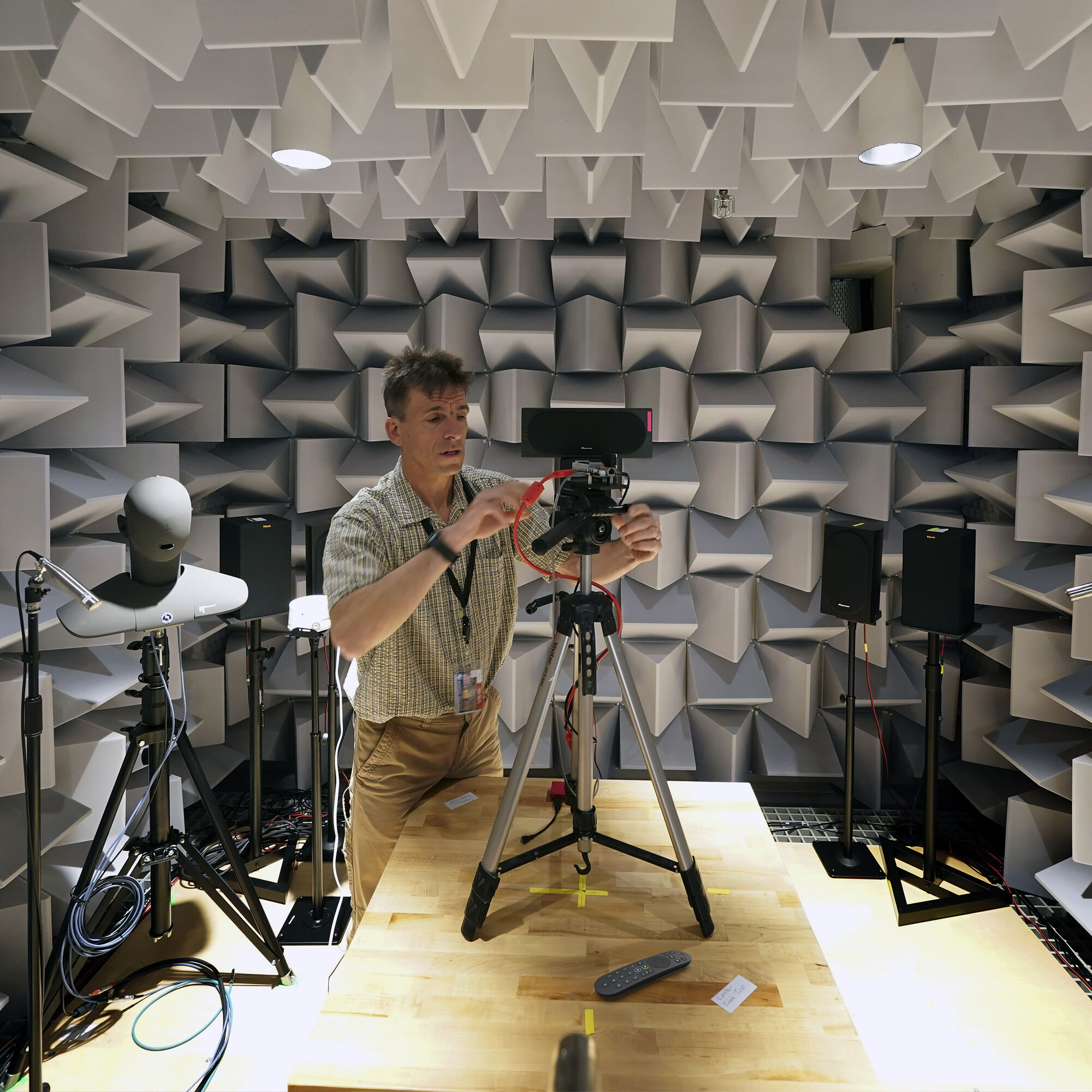 A sound engineer testing microphones.