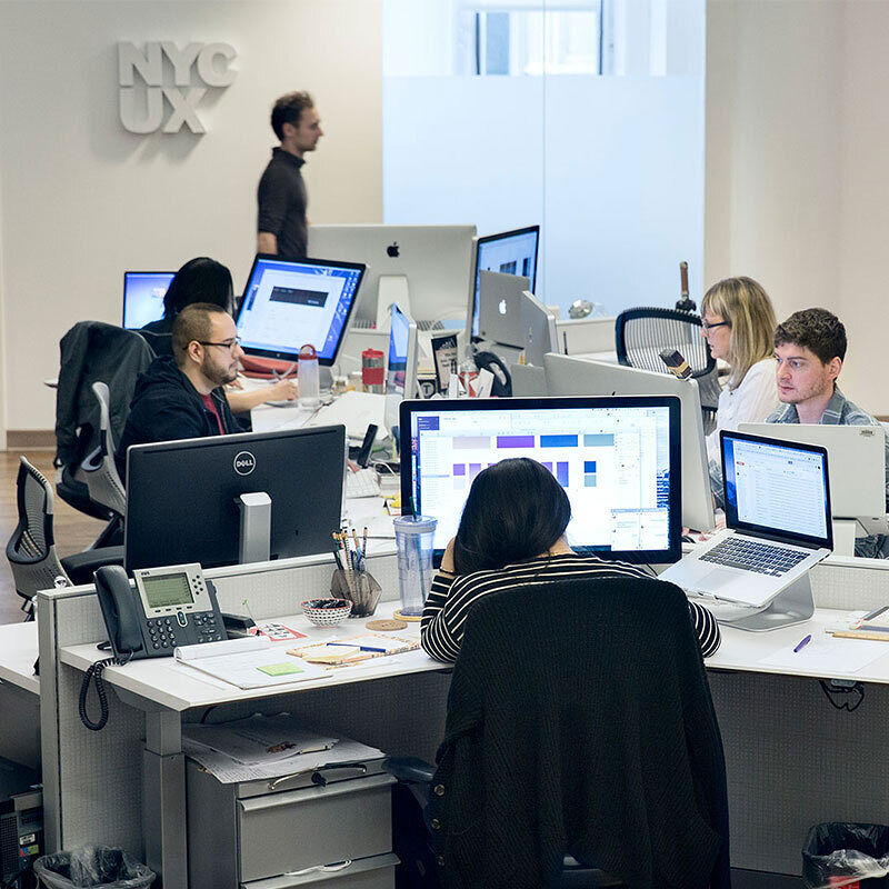 Developers using desktop computers in an office.