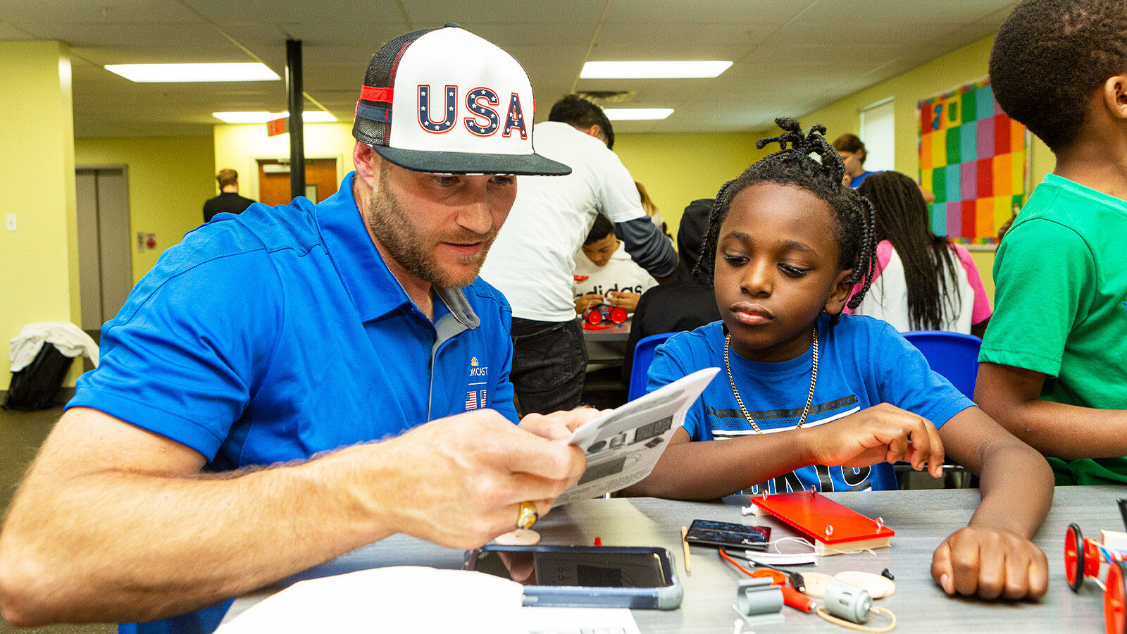 Comcast volunteers participate in Easterseal’s toy modification workshop as part of Team UP.