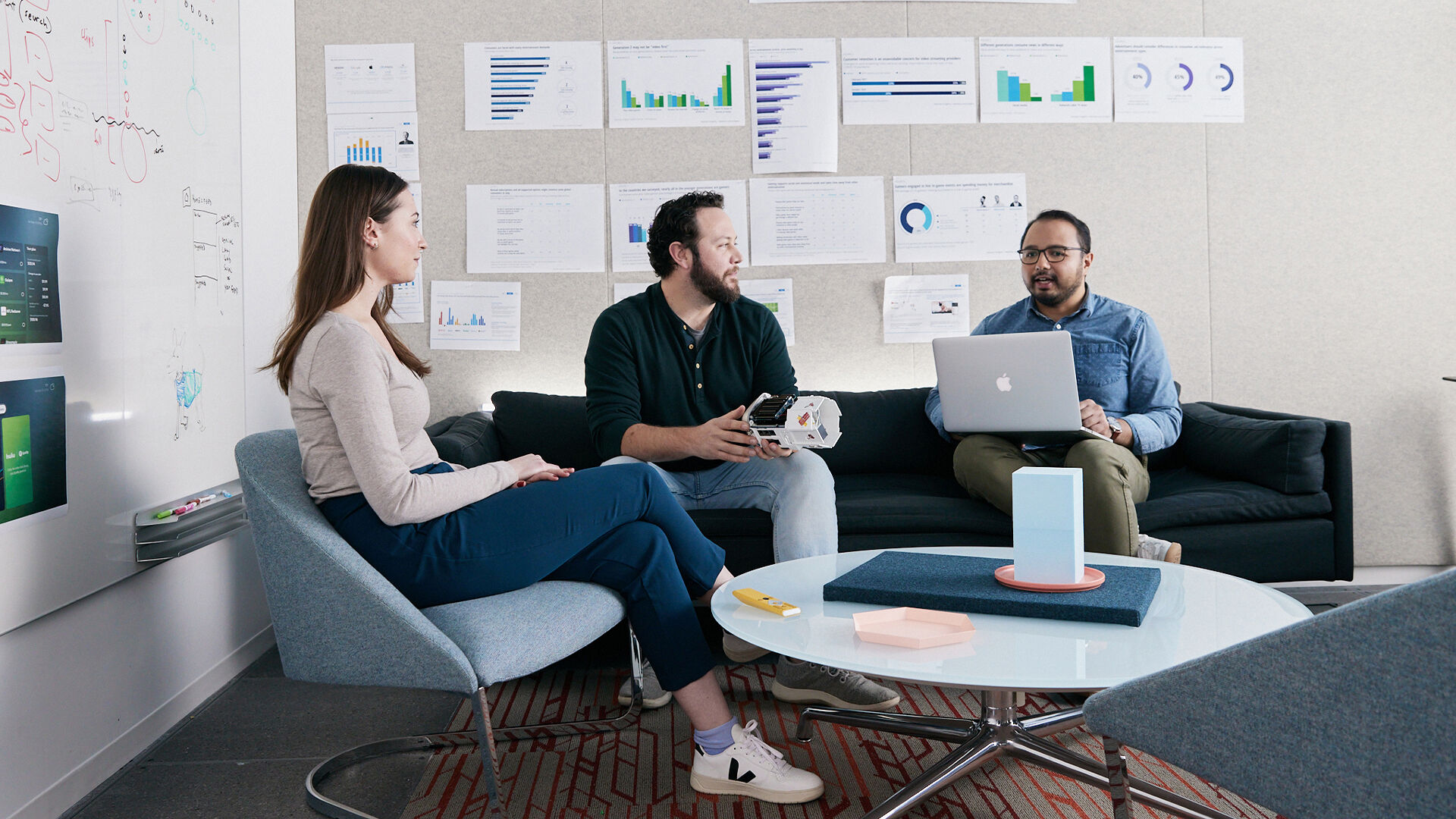 Technology teammates work at a whiteboard