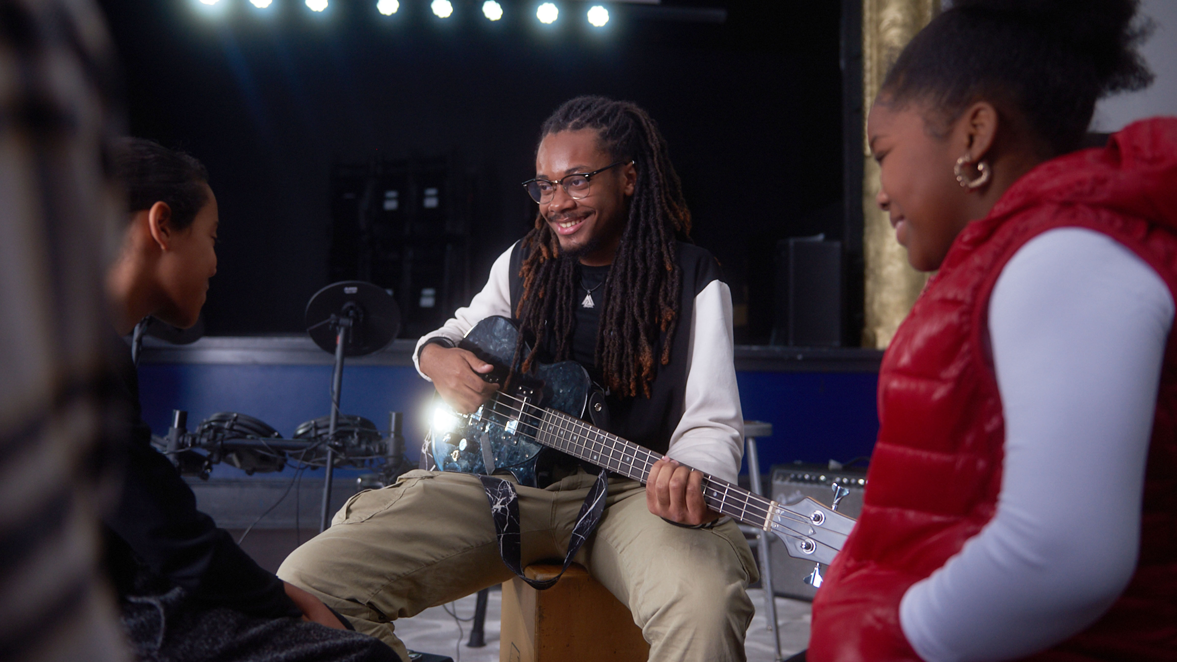 A student playing the guitar.