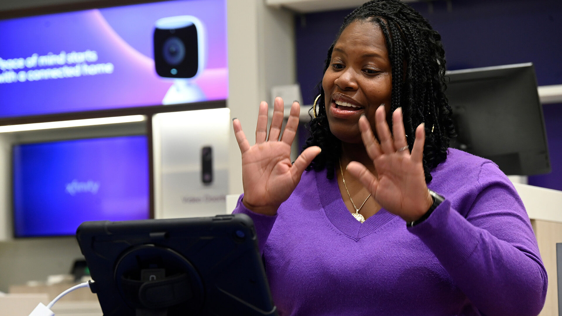 Alycia, Xfinity customer and teacher at the Pennsylvania School for the Deaf, using the American Sign Language (ASL) Video Remote Interpreting (VRI) service at an Xfinity retail store.