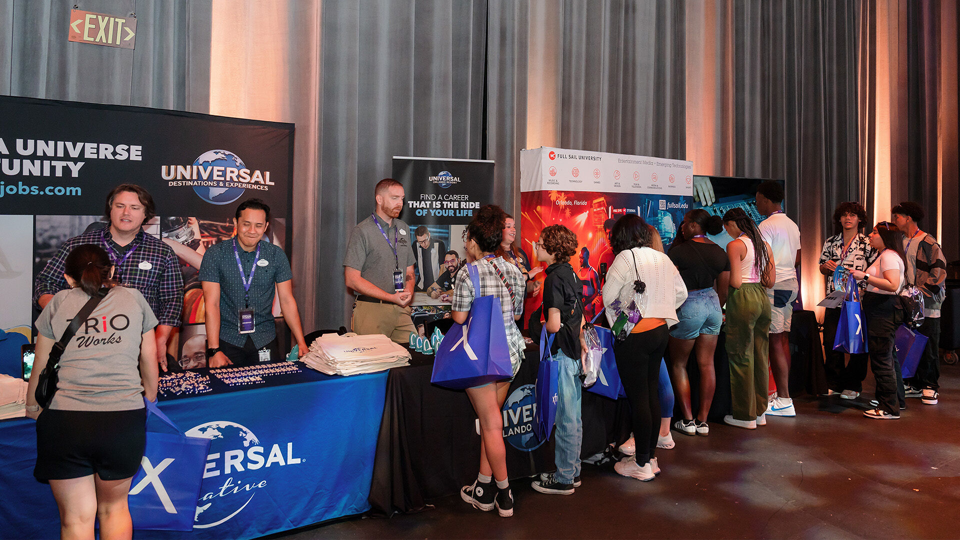 Students engaging in booths at the STEAM college and career fair.